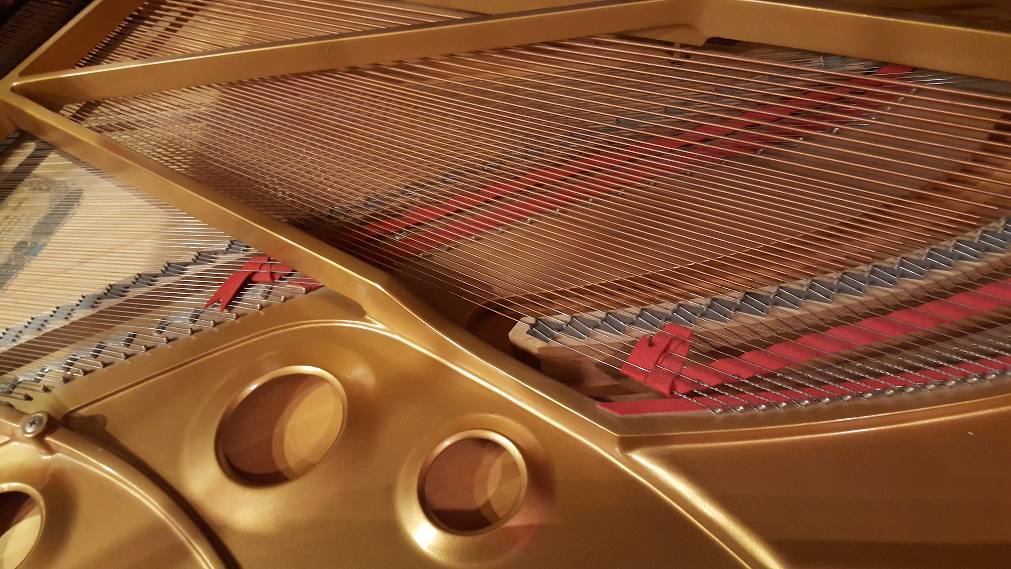 The inside of the Studio's Kawai grand piano.